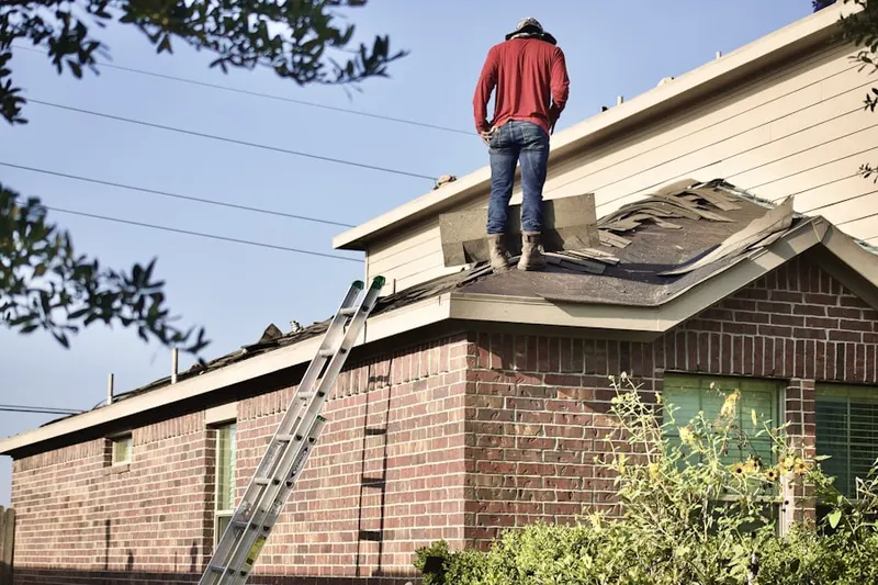 Professional roofer working on a residential roof in Tukwila Urban Center